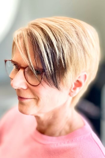 Blonde Asymmetrical Pixie with Dark Underlayer Hairstyle, side view.