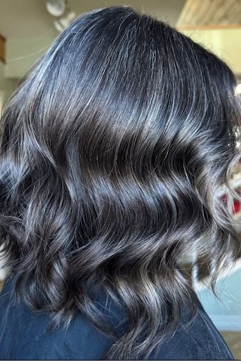 Charcoal Gray Blended Wavy Dark Hair, side view.