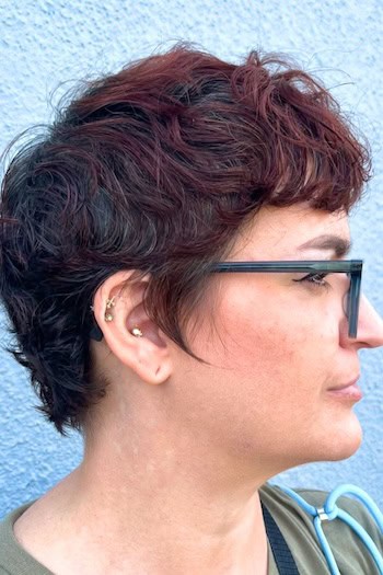 Razor-Cut Wavy Pixie Hairstyle, side view.