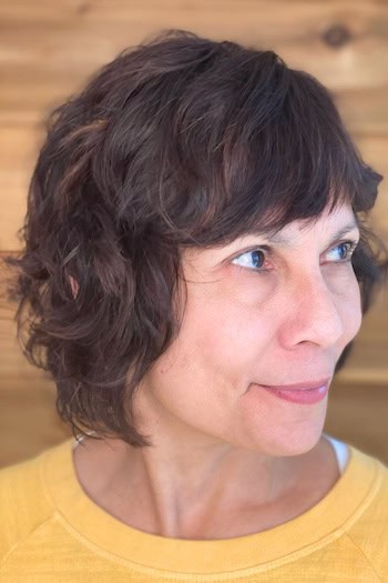 Short Wavy Shag with Bangs Hairstyle