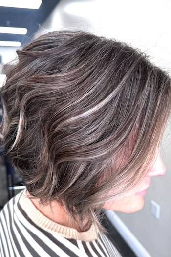 Textured Gray Blended Angled Bob Hairstyle, side view.