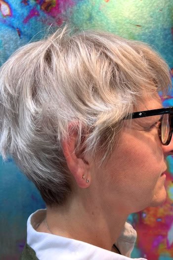 Tousled Silver Pixie Hairstyle, side view.