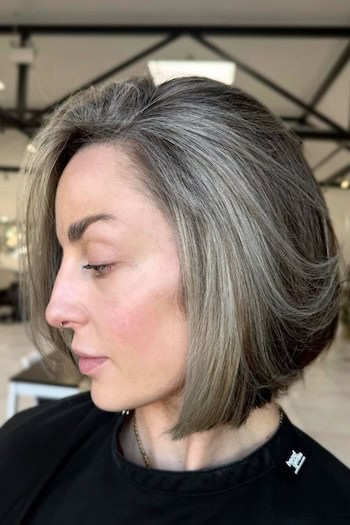Gray Blended Bob with Face-Framing Gray Highlights Hairstyle, side view.