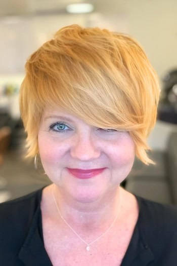 Short Shaggy Pixie with Long Side-Swept Bangs Hairstyle