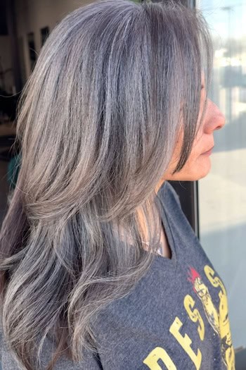 Gray Blending on Dark Layered Hair, side view.
