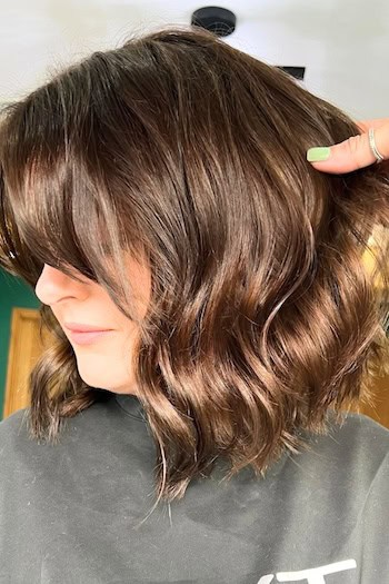 Textured Chocolate Brown Bob with Bangs, side view.