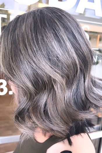 Wavy Gray Blended Bob Hairstyle, side view.