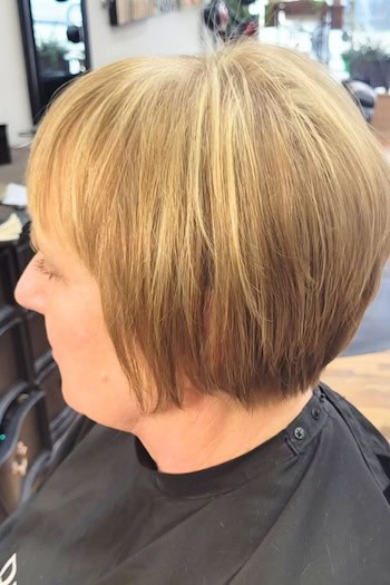 Short Tapered Bob with Bangs Haircut, side view.