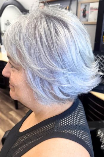Silver Layered Bob with Flipped-Up Ends Haircut, side view.