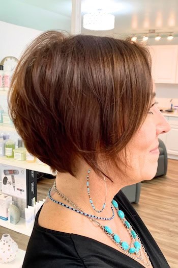 Short Tapered Brown Bob with Layers Haircut, side view.
