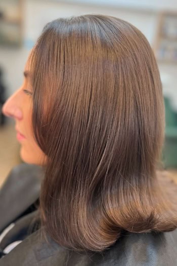 Brown Long Bob with Flipped Ends Hairstyle, side view.