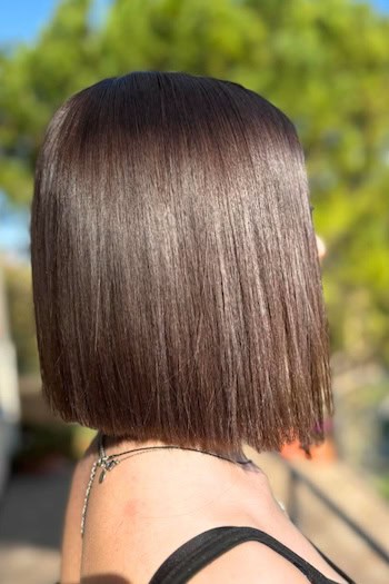 Chocolate Brown Blunt Long Bob Hairstyle, side view.