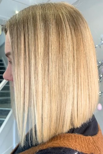 Straight Blonde Blunt Long Bob Hairstyle, side view.