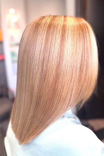 Golden Blonde Tapered Long Bob Hairstyle, side view.
