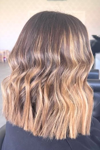 Blunt Long Bob with Highlights and Waves Hairstyle, back view.