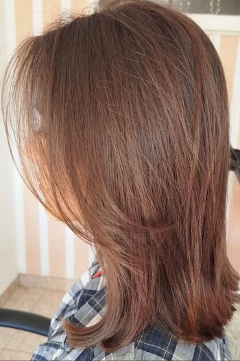 Brunette Layered Lob Hairstyle, side view.