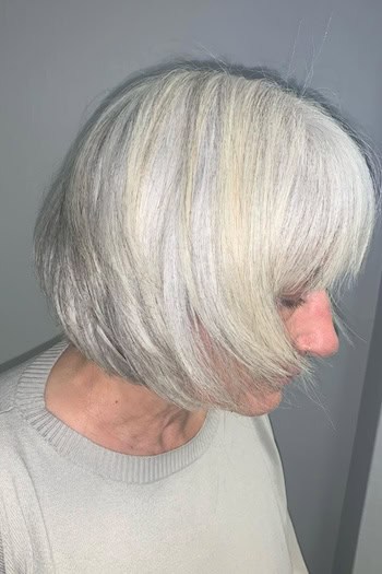 Textured White Layered Bob With Bangs Hairstyle