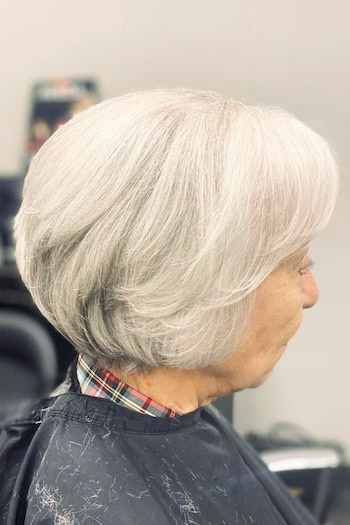 Curved Silver Bob With Side Bangs Hairstyle
