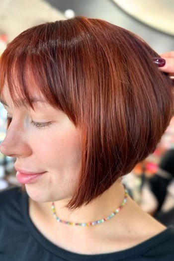 Short Angled Chin-Length Bob With Bangs Hairstyle