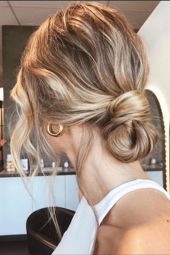 Low Bun With Loose Waves Hairstyle