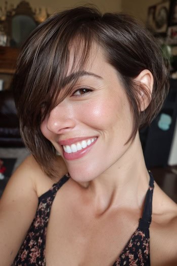 Brunette Bixie with Long Side-Swept Bangs Haircut