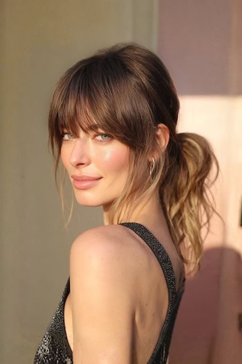 Tousled Low Ponytail with Full Bangs Hairstyle
