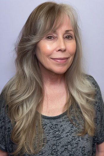 Soft Layered Waves With Side-Swept Bangs Hairstyle