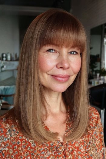 Straight Hair with Full Bangs Hairstyle