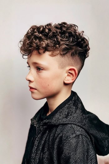 Curly Top with Mid Skin Fade Boys Haircut