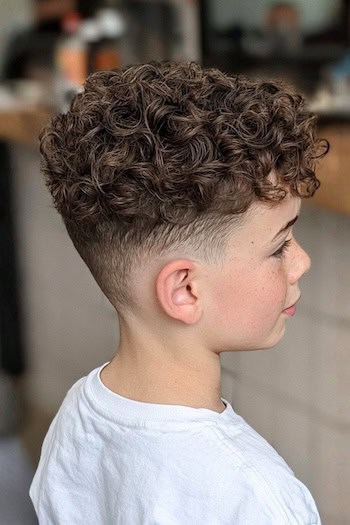 Textured Curls with Fade and Bangs Haircut
