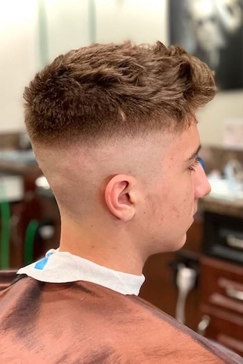 High Skin Fade and Textured Top Haircut